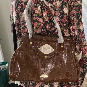 Elegant Brown Crocodile Handbag by Iman.